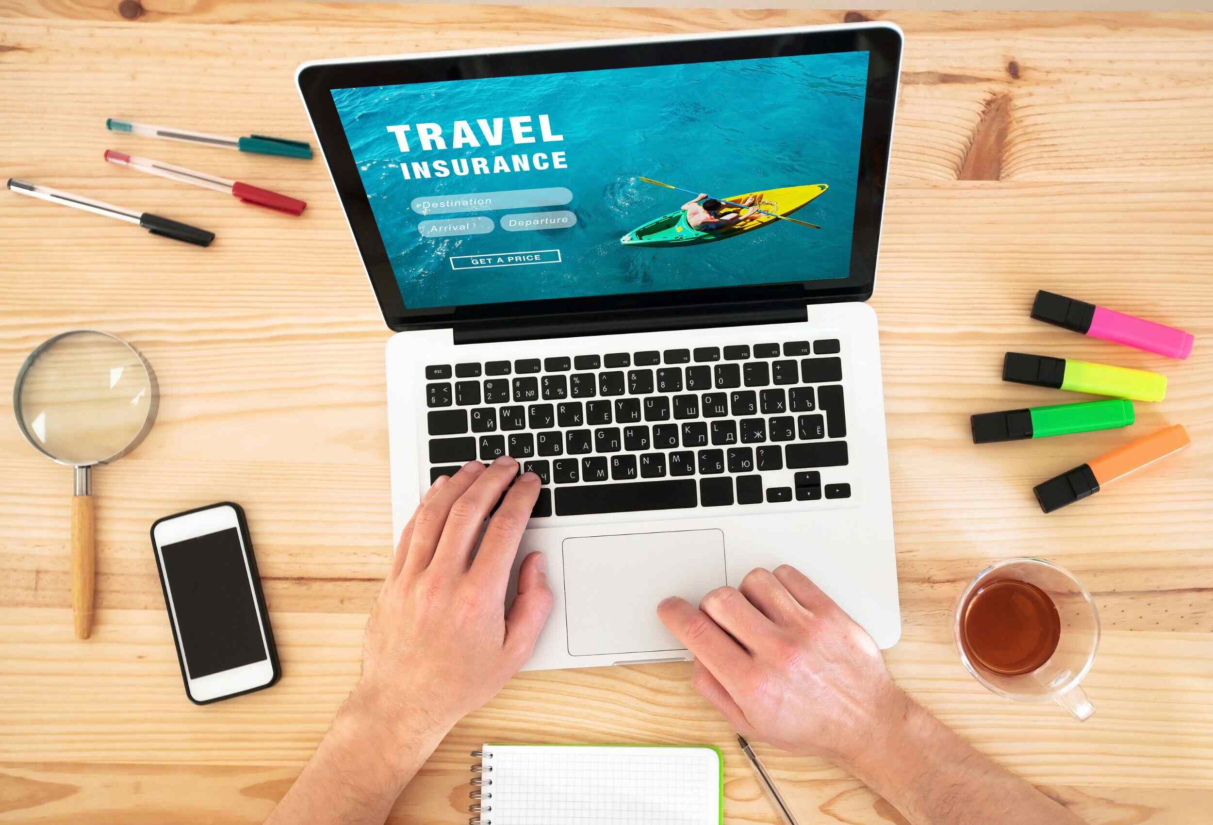 a person selects adventure sports travel insurance on a laptop