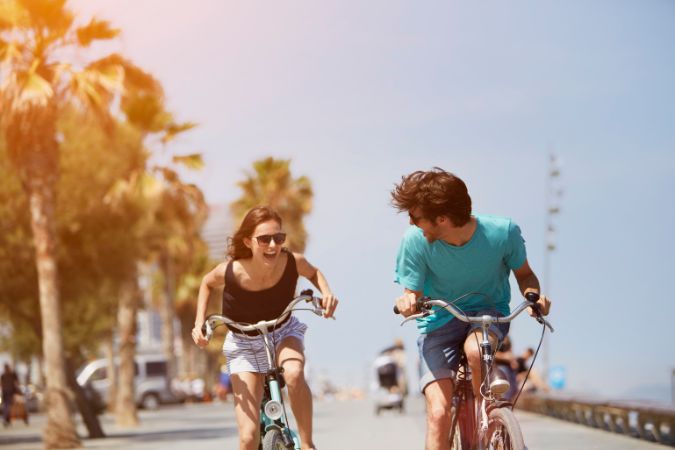 a couple in love riding bicycles