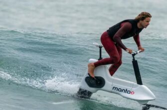 a man riding a water bike on the water