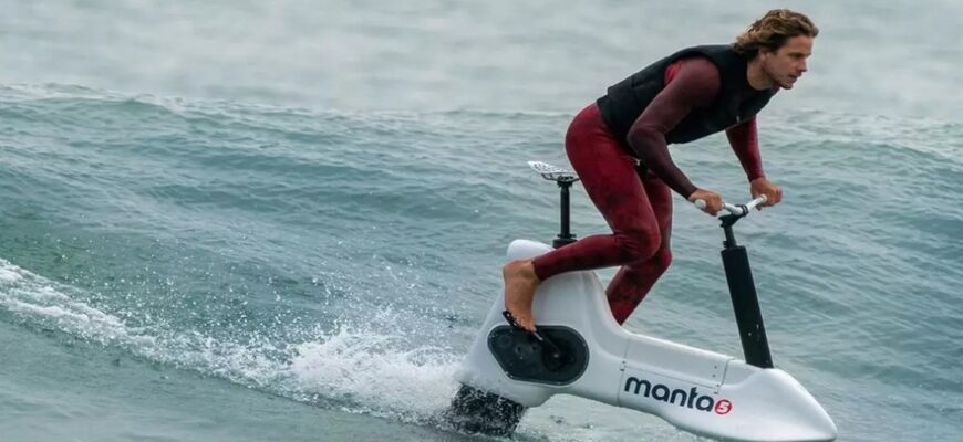 a man riding a water bike on the water